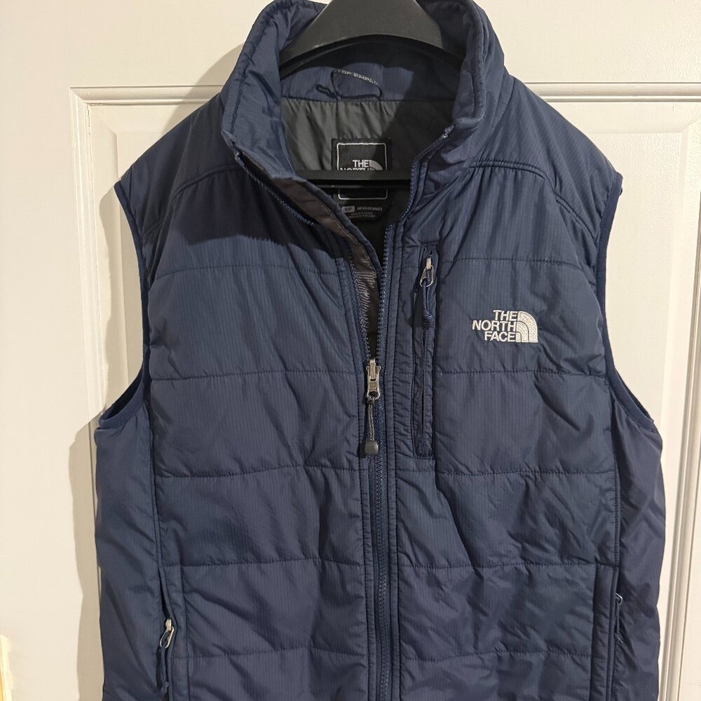 Northface navy down vest in men's size medium